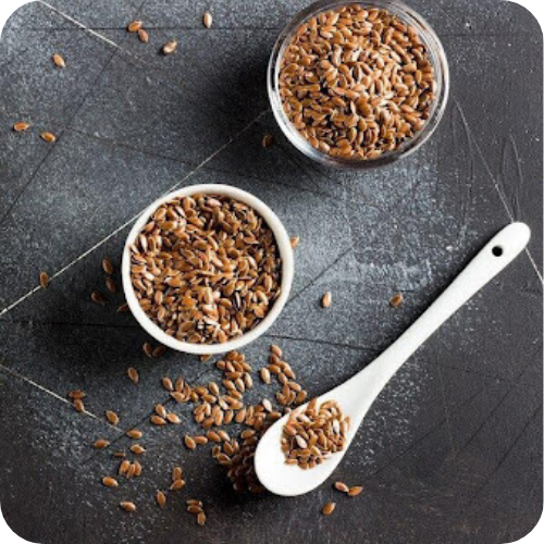 Raw flax seeds in bowl with spoon