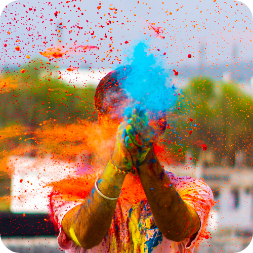Boy playing with Holi colors